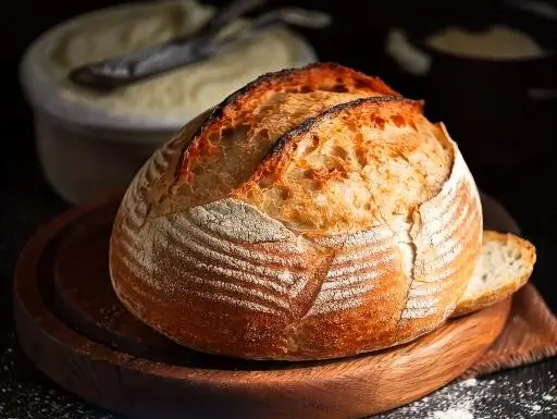 Freshly baked sourdough bread with a crispy crust and airy interior.