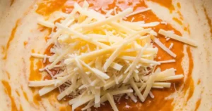 melting cheese to create the yummy sauce for mac and cheese